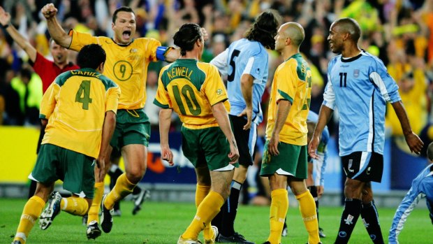 Famous victory: Mark Bresciano, second from right, celebrates scoring against Uruguay in 2005.