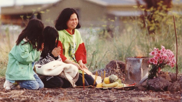 Mrs Chan and her daughters perform a service for Karmein Chan where her body was discovered in Thomastown.