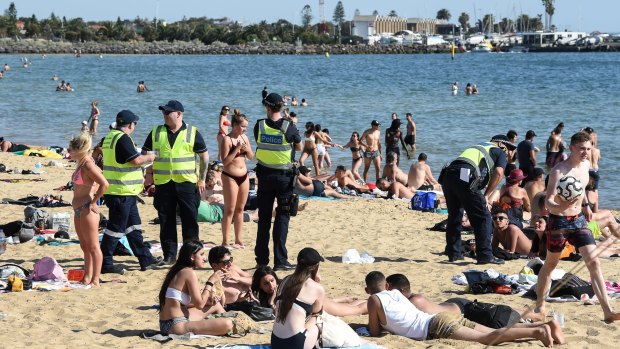 Police patrol St Kilda Beach in Melbourne.