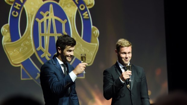 Cheers! Trent Cotchin and Sam Mitchell enjoyed the low-key ceremony.