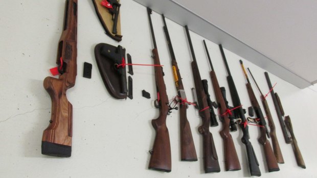 Police seized a number of firearms plus ammunition from a Fisher property.