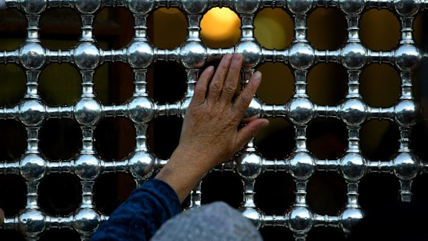 The outer fencing looking through to the tomb of Imam Hussein, inside the shrine.