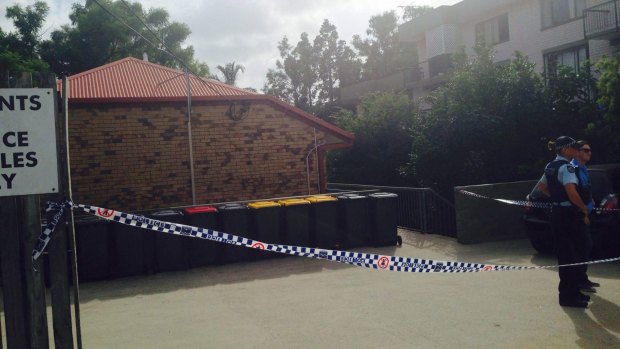Police have established a crime scene at the apartment complex in Highgate Hill.