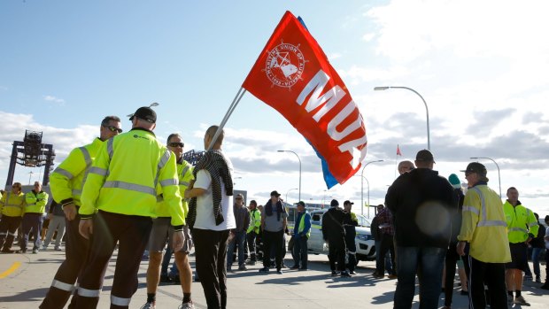 Hutchison Ports Australia's workers gather at Port Botany, Sydney, after being sacked by email overnight.