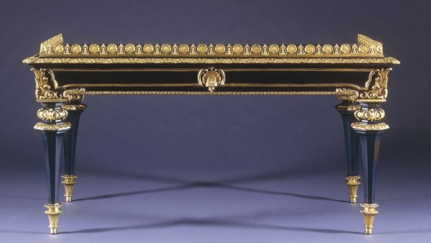 A British ebony and gilt-mounted writing table attributed to Robert Hume the Younger, from around 1815.