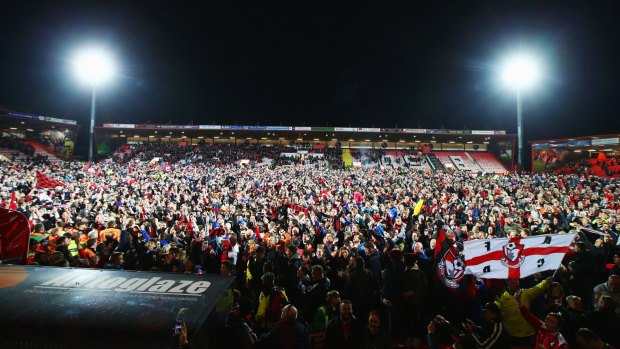 Bournemouth fans invade the pitch after the team's win.