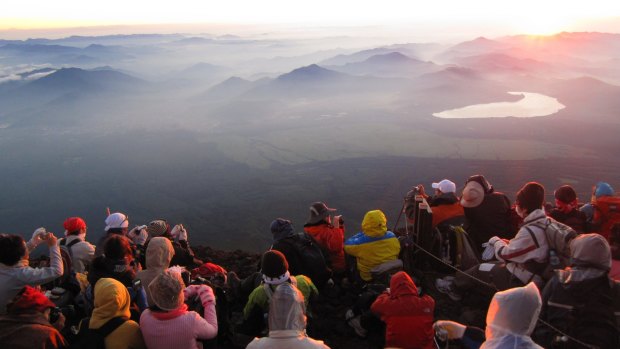 Fuji's summit: Satisfied pilgrim reach their goal.