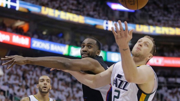 Los Angeles Clippers forward Luc Richard Mbah a Moute and Utah Jazz forward Joe Ingles (right) vie for a rebound in game six.