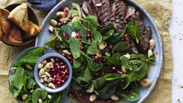 Lamb, spinach and date salad with crisp pita.