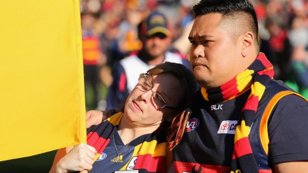Crows supporters honour fallen coach Phil Walsh at Adelaide Oval.