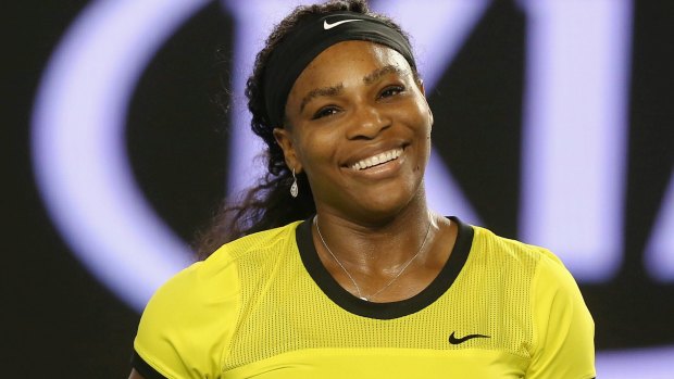 All smiles: Serena Williams celebrates victory.