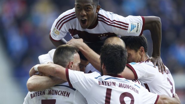 Bayern Munich players celebrate Robert Lewandowski's goal.
