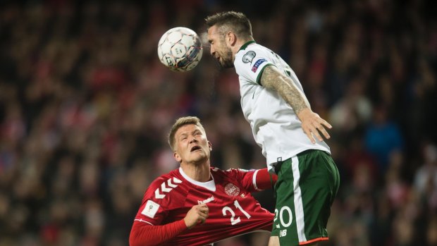 Ireland's Shane Duffy and Denmark's Andreas Cornelius in action during the qualifier.