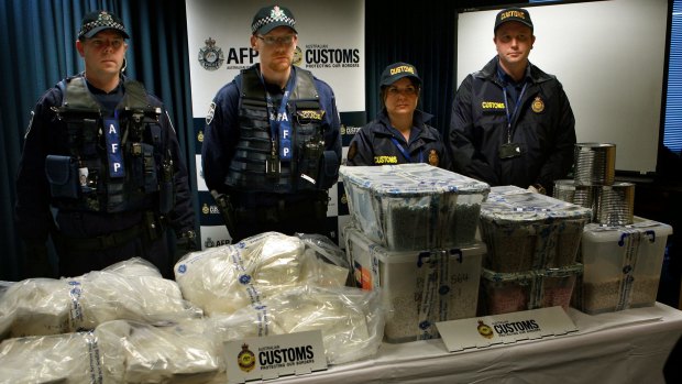 Federal Police and Customs agents with some of the Ecstasy and Cocaine after the drug bust.