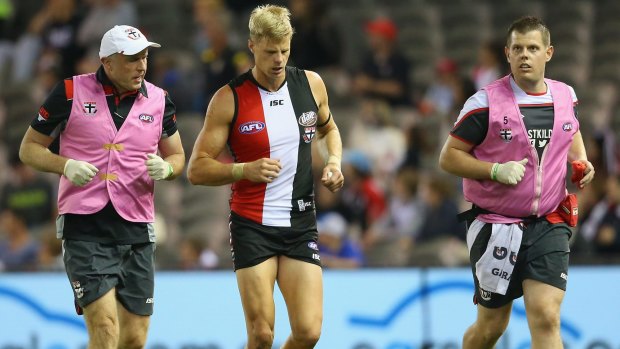 Nick Riewoldt comes off the ground after a big hit in the last quarter.