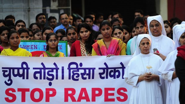 Indian Christians and social activists take part in a peace-rally and protest against the gang-rape of a nun in Allahabad on Monday. 