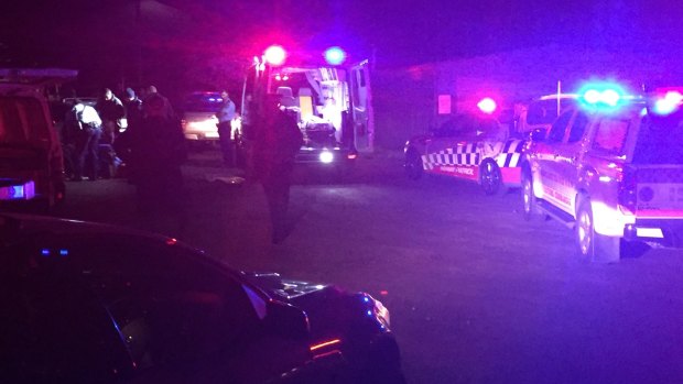 Police and paramedics treat a toddler after he was hit by a car at Bathurst.