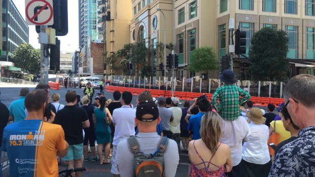 Crowds gather outside the Marriott Hotel on Adelaide Street.