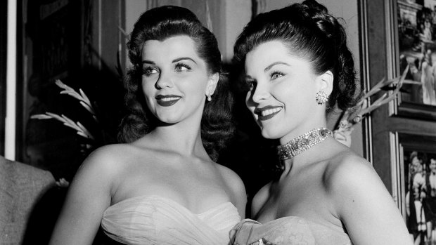 Actress Debra Paget and sister Lisa Gaye attend the movie premiere of "The Robe" in LA, 1953.
