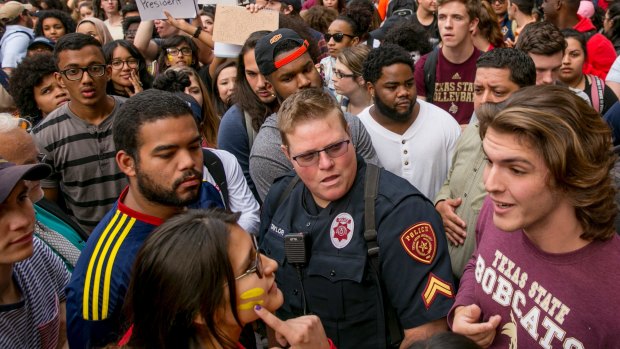 Protester Patricia Romo, left, 22, argues with Trump supporter Cody Williams, 18, during a demonstration at Texas State University in San Marcos.