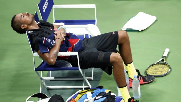 Chilling out: Kyrgios rests on his chair during the first round of the US Open against Andy Murray.