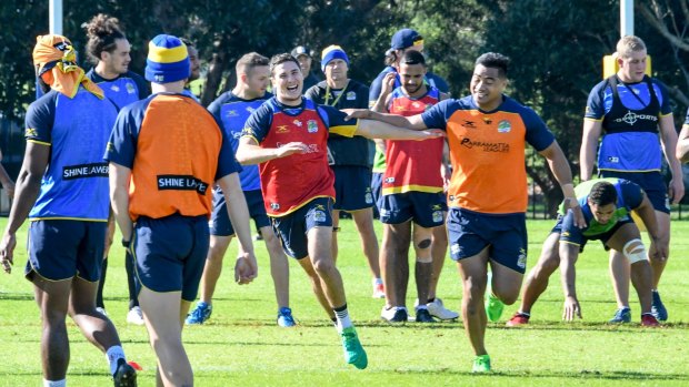 Protection: Mitchell Moses joins new Eels teammates for the first time at training on Tuesday.
