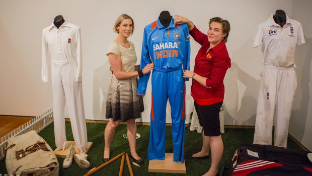 Padding up: Social History Curator of the Canberra Museum and Gallery Sharon Bulkeley, left, and Assistant Curator of the Bradman Museum Belinda McMartin at the Bradman exhibition at Canberra Museum and Gallery.
