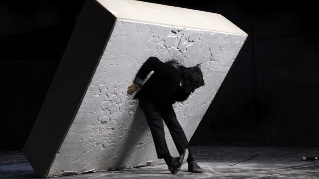 Dimitris Papaioannou manhandles what appears to be a gigantic lump of concrete across the stage in <i>Still Life</i>. 
