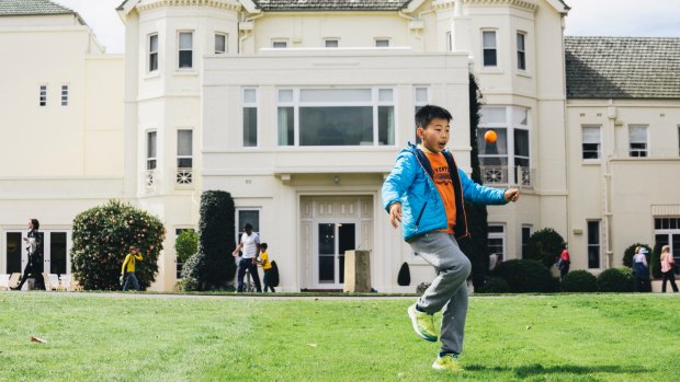 Lifu Tan, 9, of Yarralumla, playing with a ball on the lawns outside Government House on the October 2016 Open Day. 