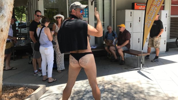 Australian Sex Party Queensland secretary Robin Bristow gets a bit cheeky at a nude beach protest.