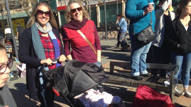 Amanda Charles, her partner and six-month-old twins rally for gay marriage on Sunday in Civic.