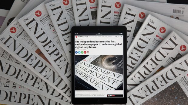 The Independent iPad app in front of copies of the paper.