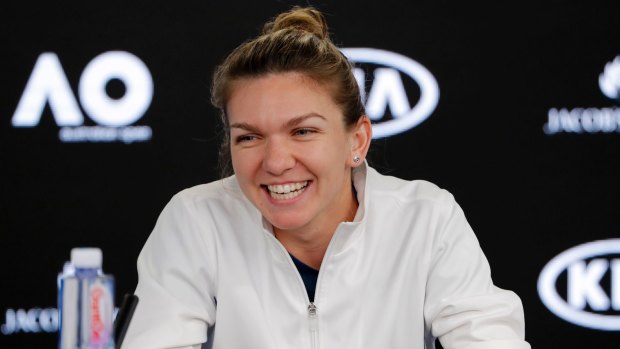 Romania's Simona Halep smiles at a press conference at Melbourne Park.