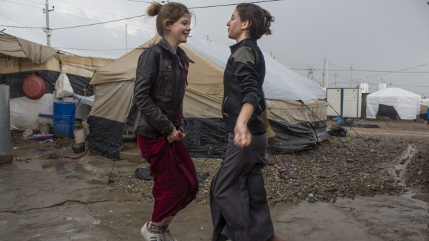 Yazidi girls play in a refugee camp in Northern Iraq.