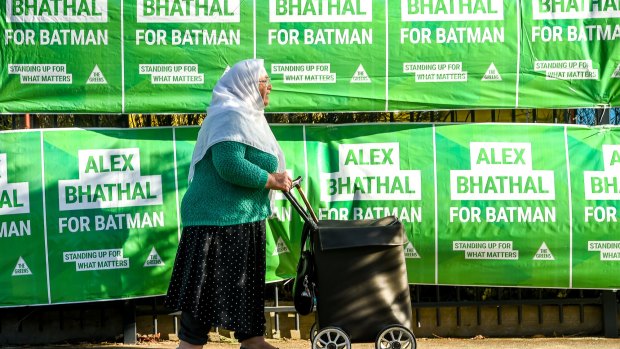 A woman walks past Sacred Heart Primary School in Preston.