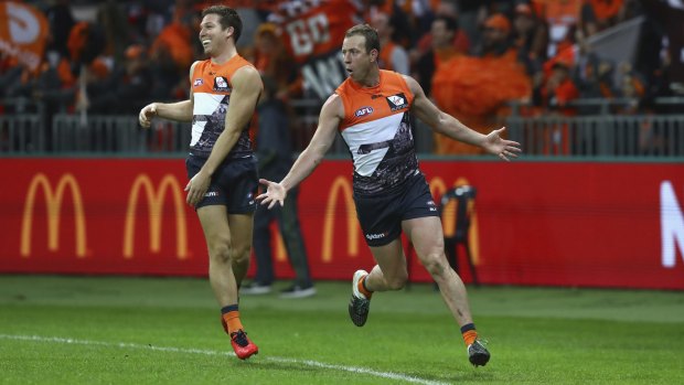 Rejoice: Giants veteran Steve Johnson celebrates after a goal during the clash with the Sydney Swans in June.