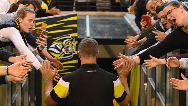 Hardwick high fives fans after a win over the Demons in round five.