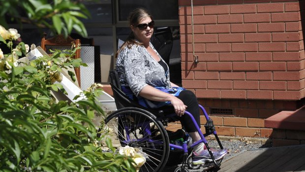 Hazel Passmore is seen leaving her property in Davoren Park, South Australia.