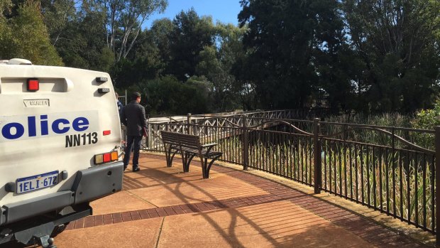 Police cordon off the park after a man's body was discovered on Saturday. 