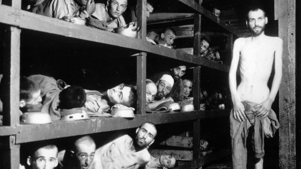 This April 16, 1945 file photo provided by the US Army shows inmates of the  Buchenwald concentration camp. The young man seventh from left in the middle row bunk is Elie Wiesel.