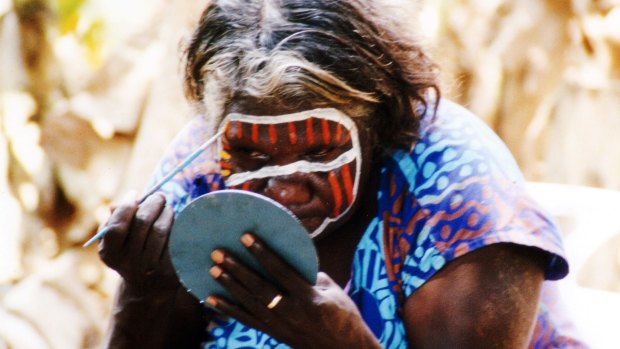 Bathurst islander Mary paints her face in preparation for performing some Tiwi dances for visitors to the islands. 