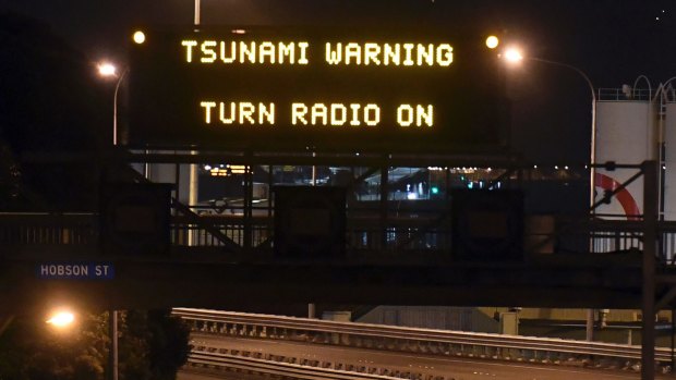 A tsunami warning is displayed on a motorway in Wellington after a major earthquake struck New Zealand in November.