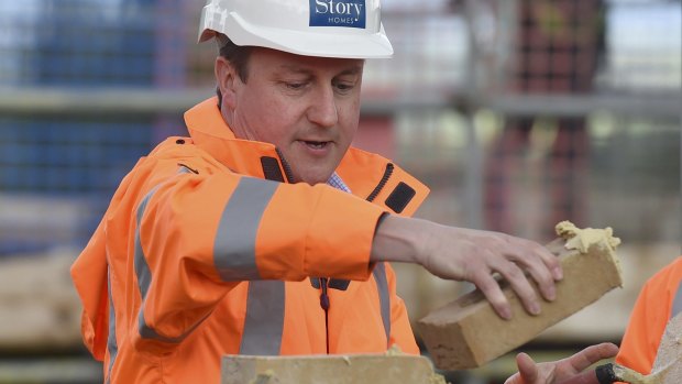 David Cameron lays bricks on the campaign trail. 