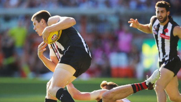 Magpie debutant Mason Cox takes his first mark early in the game.