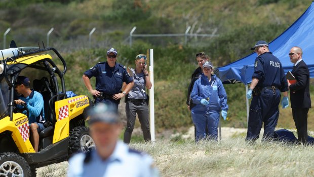 Crime scene: Police, lifeguards and a forensic team at Maroubra Beach.