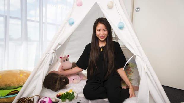 Cocobunbuns in his teepee with owner Sarah Pineda.