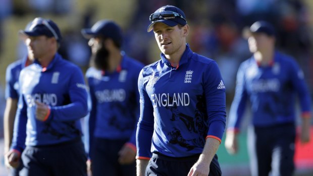 Fiasco: England captain Eoin Morgan leads his team off the field after they were annihilated by New Zealand.
