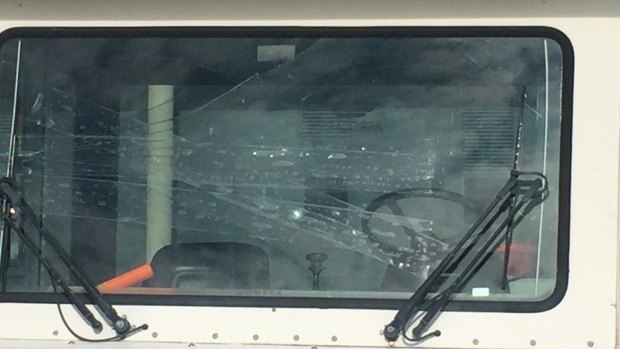 A "push-truck" at Canberra Airport with a cracked windscreen.