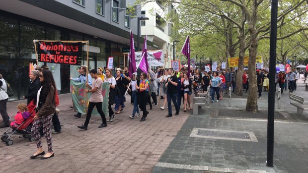 Protesters march through Canberra in opposition to Australia's asylum seeker policy and calling for the government to welcome refugees on October 8, 2017.