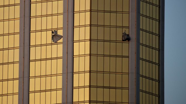 Drapes billow out of broken windows of room 35132 of the Mandalay Bay Resort and Casino.